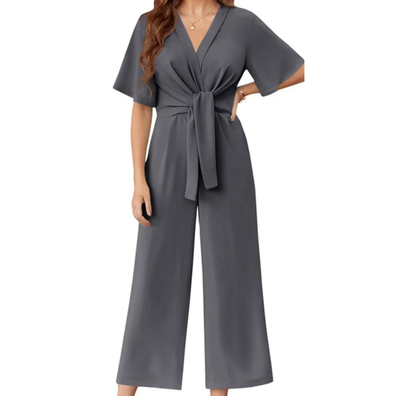 Combinaison élégante à col en V et jambes larges pour femme avec ceinture nouée